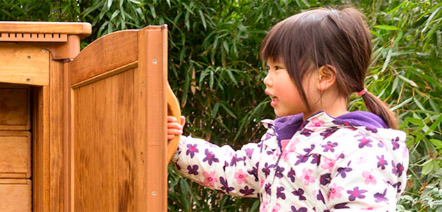 reception-aged girl opening Outlast shed