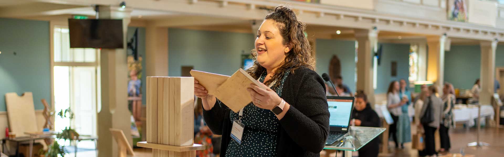 A woman stacking blocks