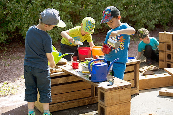 messy play with outlast blocks, four children playing