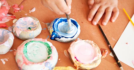 Young child mixing paints