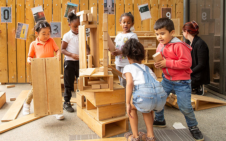 Reception age children constructing with hollow blocks