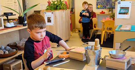 boy playing with blocks and playdough