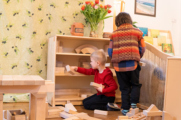 boys playing with unit blocks