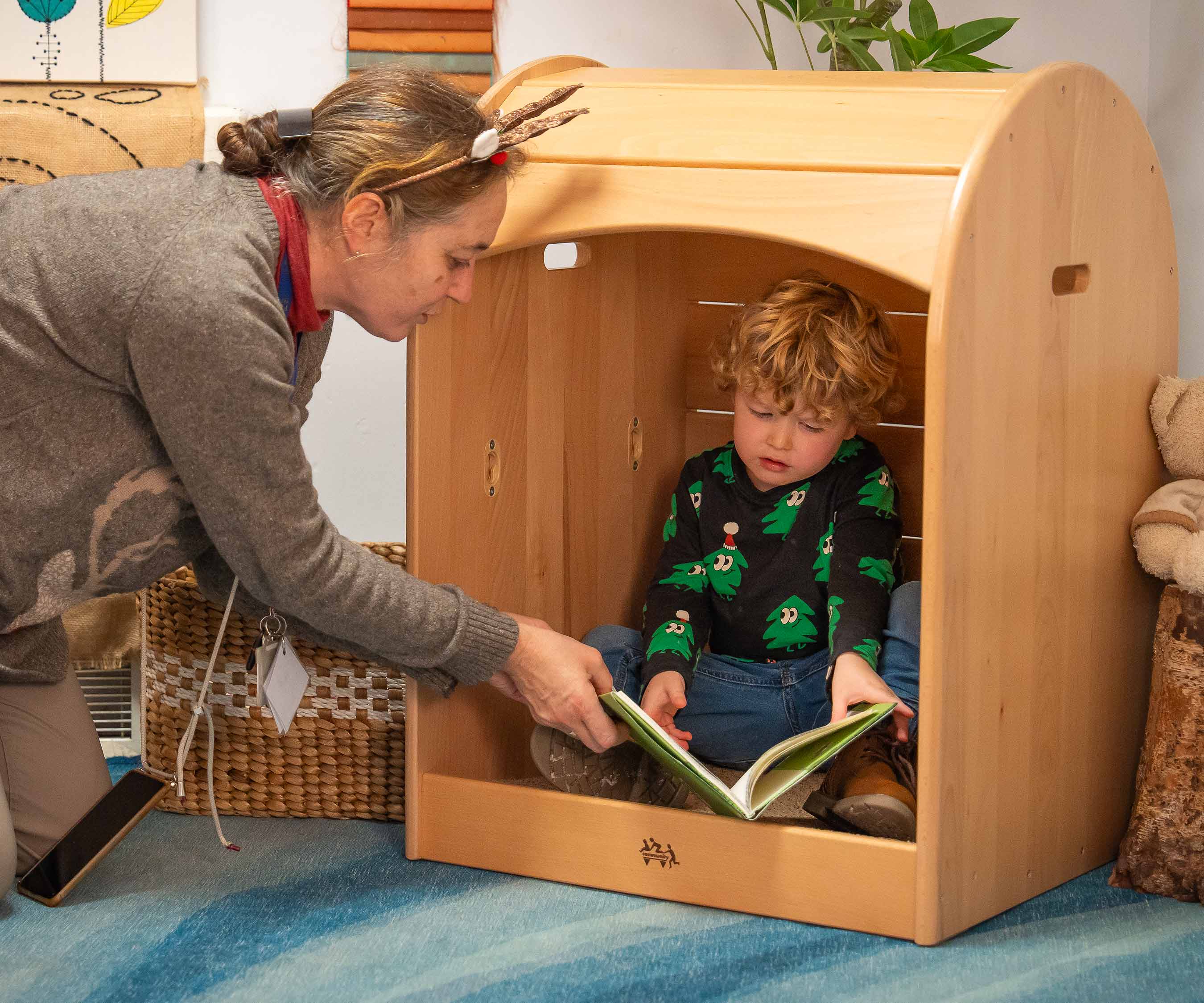 Teacher interacting with a child in a calm corner