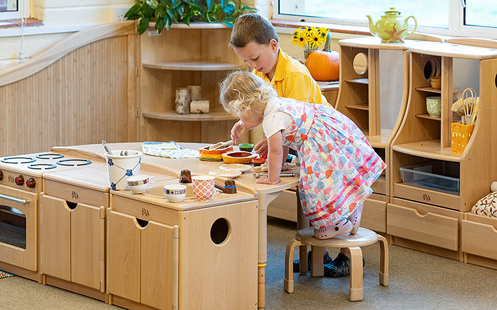 child standing on a stool