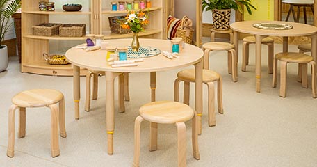 three stools around a table