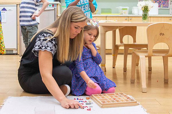a teacher and a child playing together