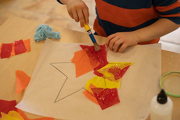 boys hands over star project