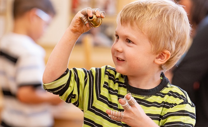 Boy  with metal rings loose parts
