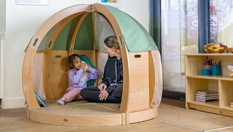 Teacher interacts with child in FlexiDen