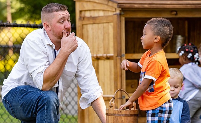 boy and teacher with outlast 