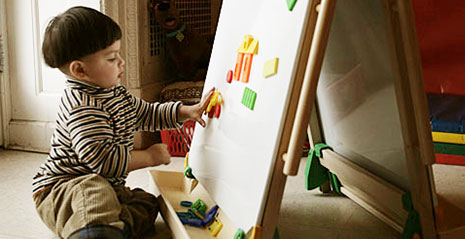 Child with art easel