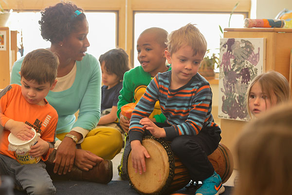 teacher and children with percussion instruments