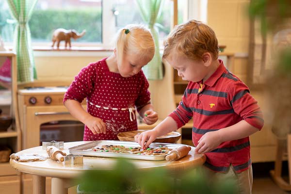 Girl and boy Christmas cookie baking