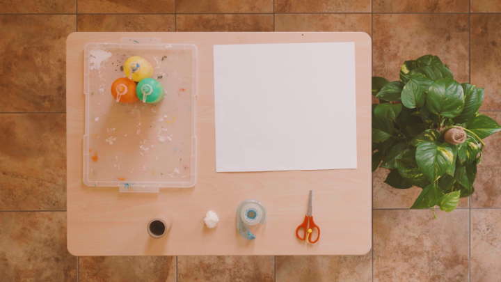 Materials needed for string roll painting laid out on a table