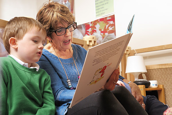 teacher and child sharing book