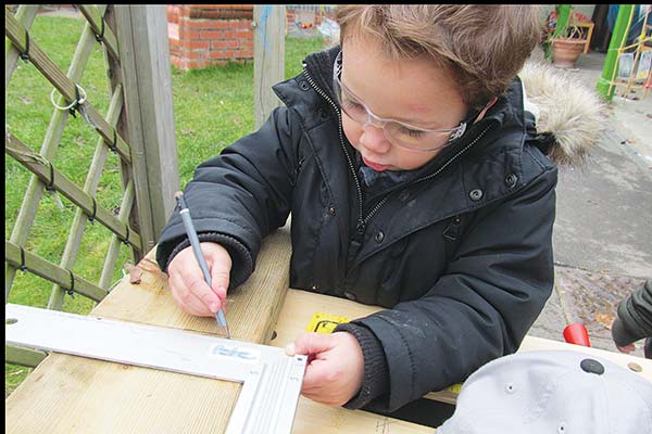 boy with square-set ruler and pencil