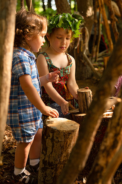 two children engrossed in outdoor role play
