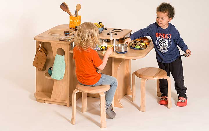 The Kitchen Island unit for role play, with two children enjoying play together.