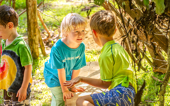 Two boys engaged in associative play