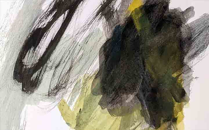 A young child's artwork composed of abstract-style scribbles and colour blocks in greys, black, and yellow.