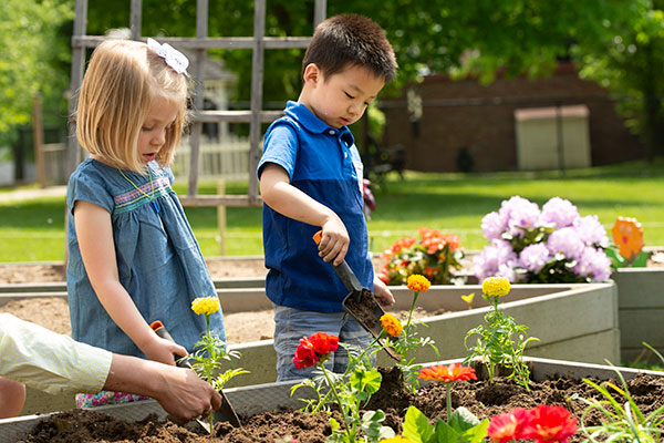 two kids gardening