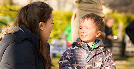 Nursery teacher talking with a child