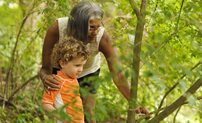 Outdoor exploration child and teacher