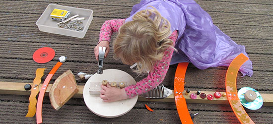 Child doing woodwork