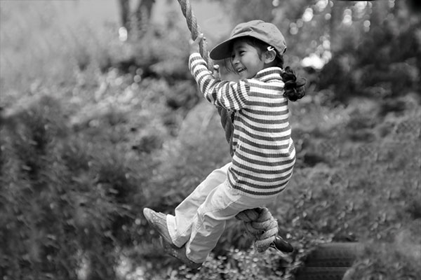 young girl on a swing