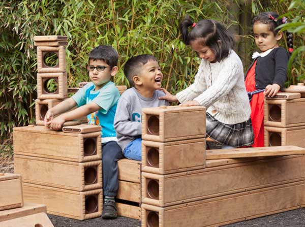 group of nursery aged children playing with outlast blocks