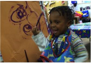 Child painting spiral patterns