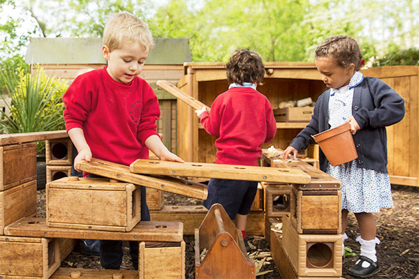 children playing with outlast blocks outdoors