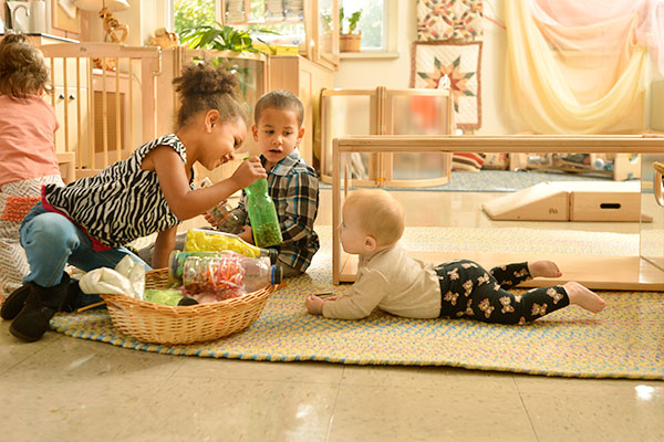 children playing with a treasure basket
