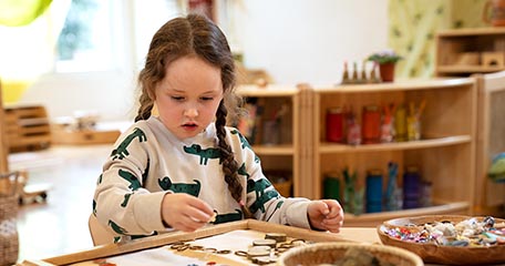 Girl playing with loose parts