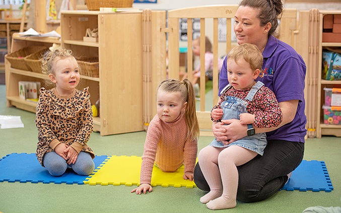 3 kids on playmat