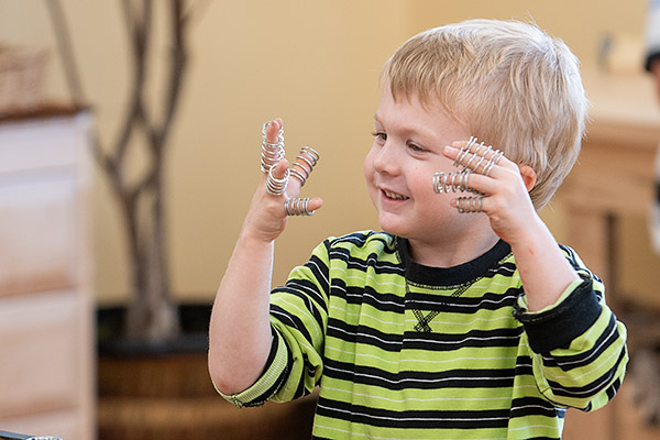 boy with coils on fingers