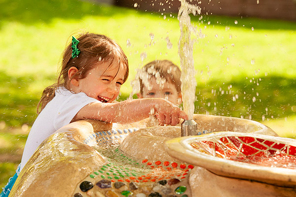 girl at water fountain