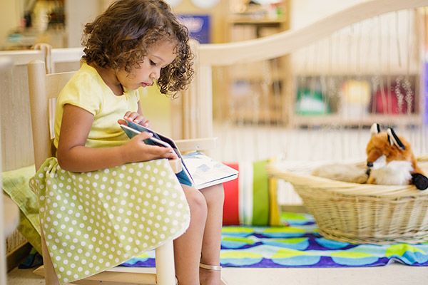 girl looking at book