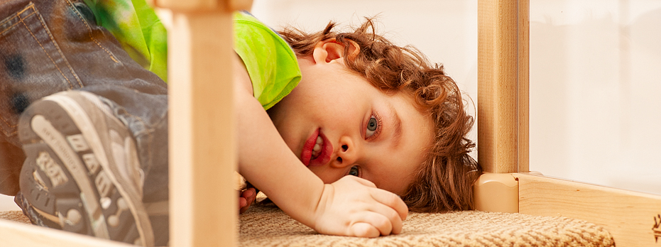 boy lying on carpet