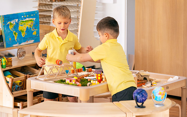 Preschoolers engaged in creative sensory play at a sensory table