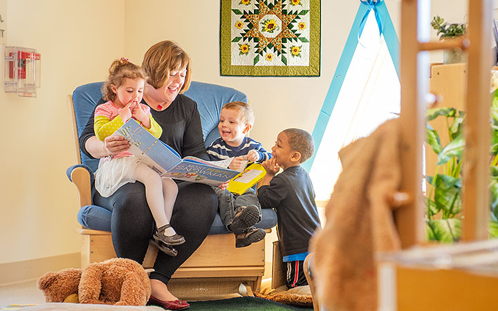 carer reading to kids