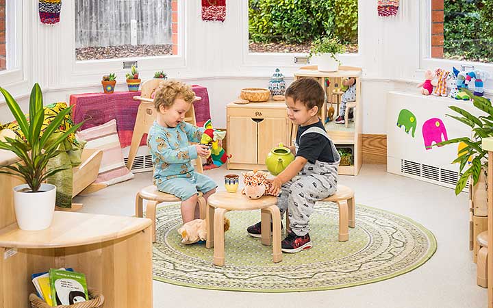 cosy space roomscapes corner with cushions and a baby shelf nearby