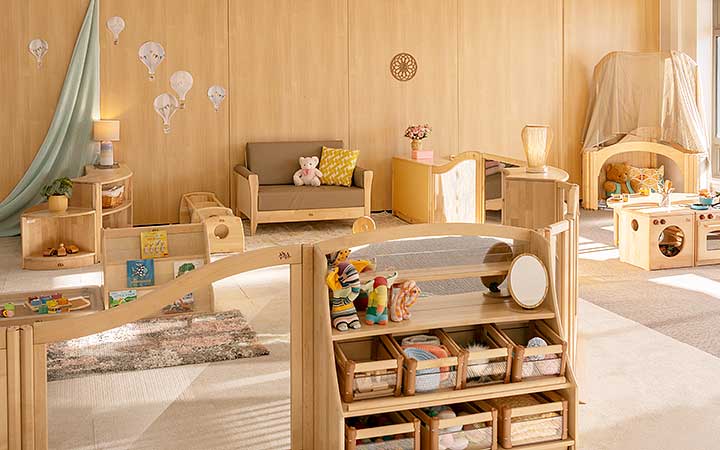 A collage of four photos showing scenes from Happy Bunnies Nursery School.