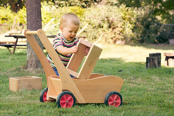 boy with pushcart and hollow block