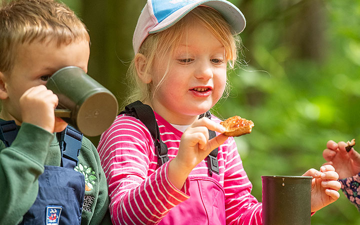 boy and girl eating outdoors