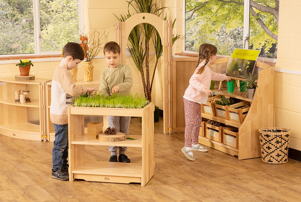 Preschool children playing with display furniture