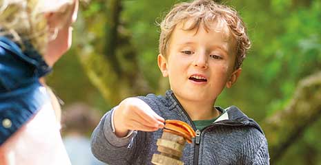 A child plays with simple materials