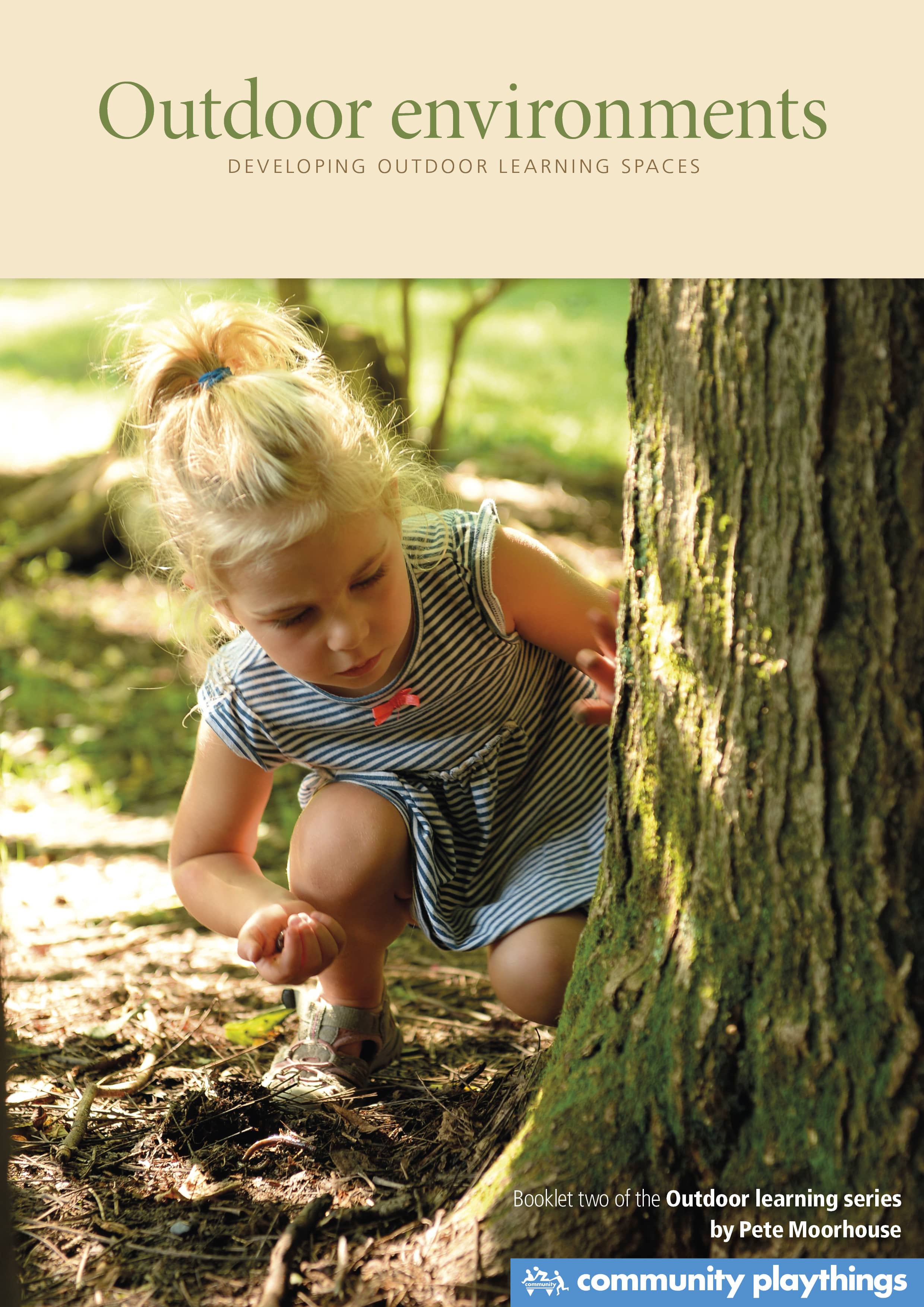 A girl looking at a woodlouse