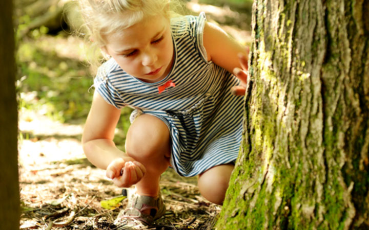 A girl by a tree